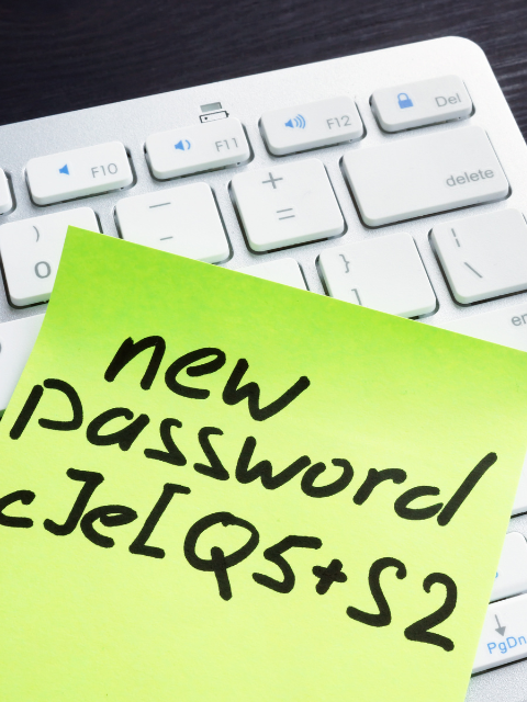 Sticky note on keyboard, with the words "New password" 